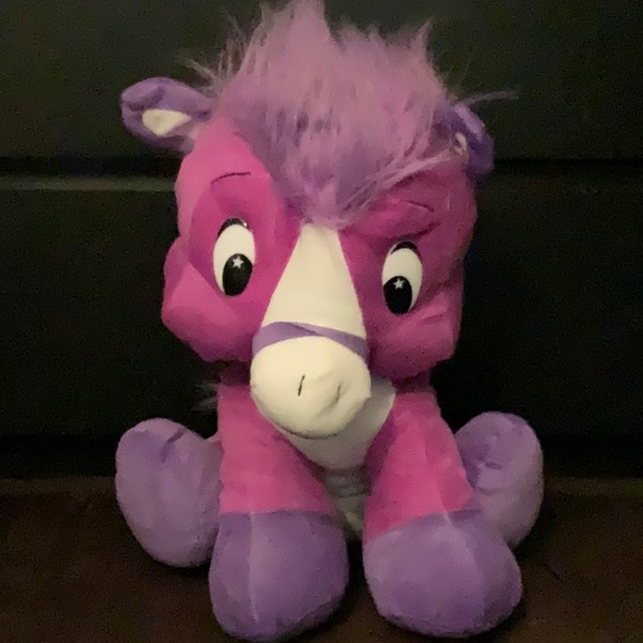 A magenta unicorn plush - Picture 1 of 1